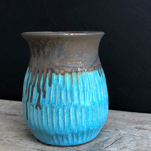 Turquoise and bronze pot with carving