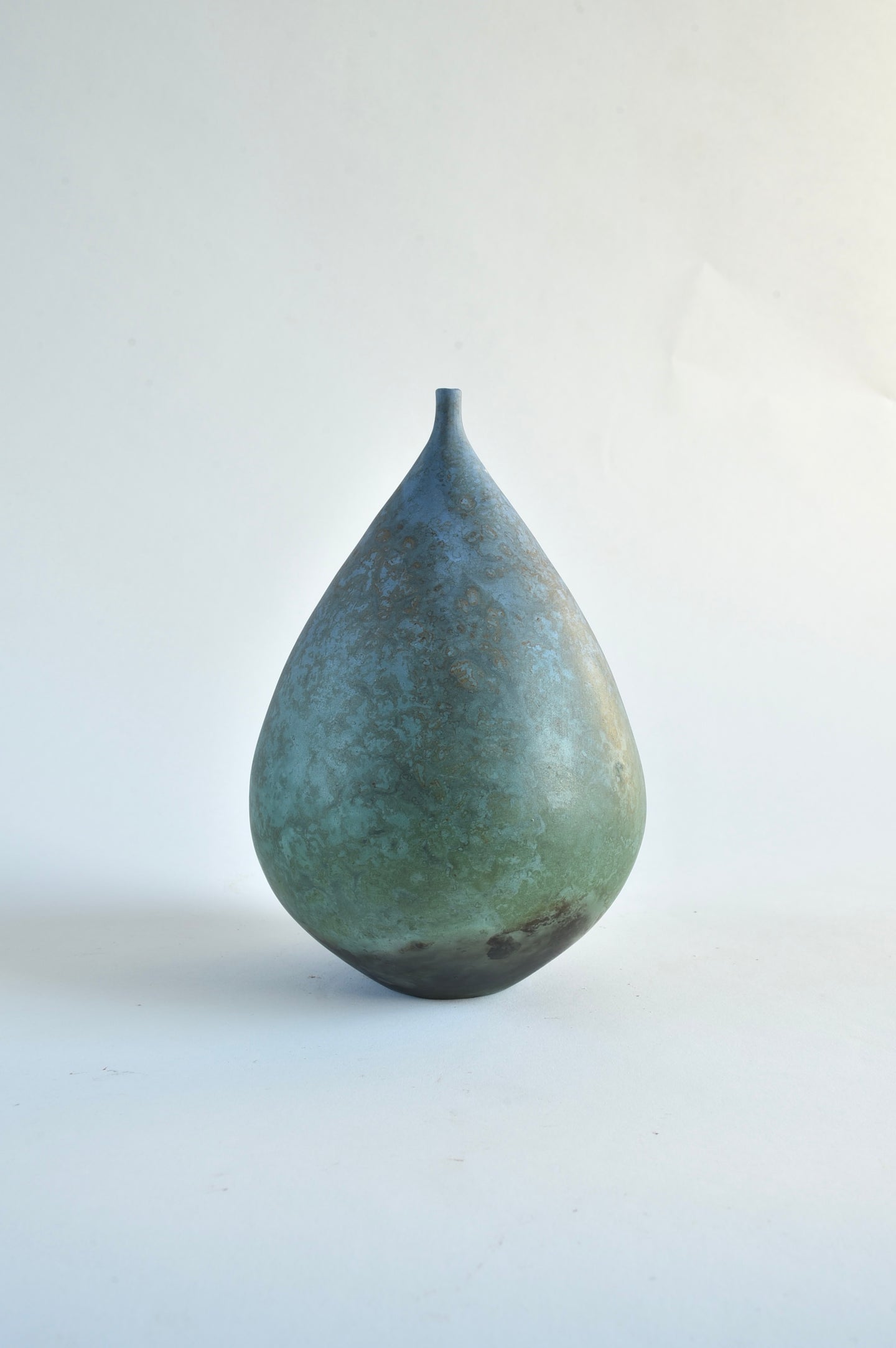 Pear shaped dark blue bottle form