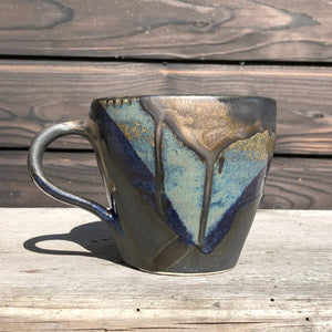 Stoneware mug with crystal and bronze glazes