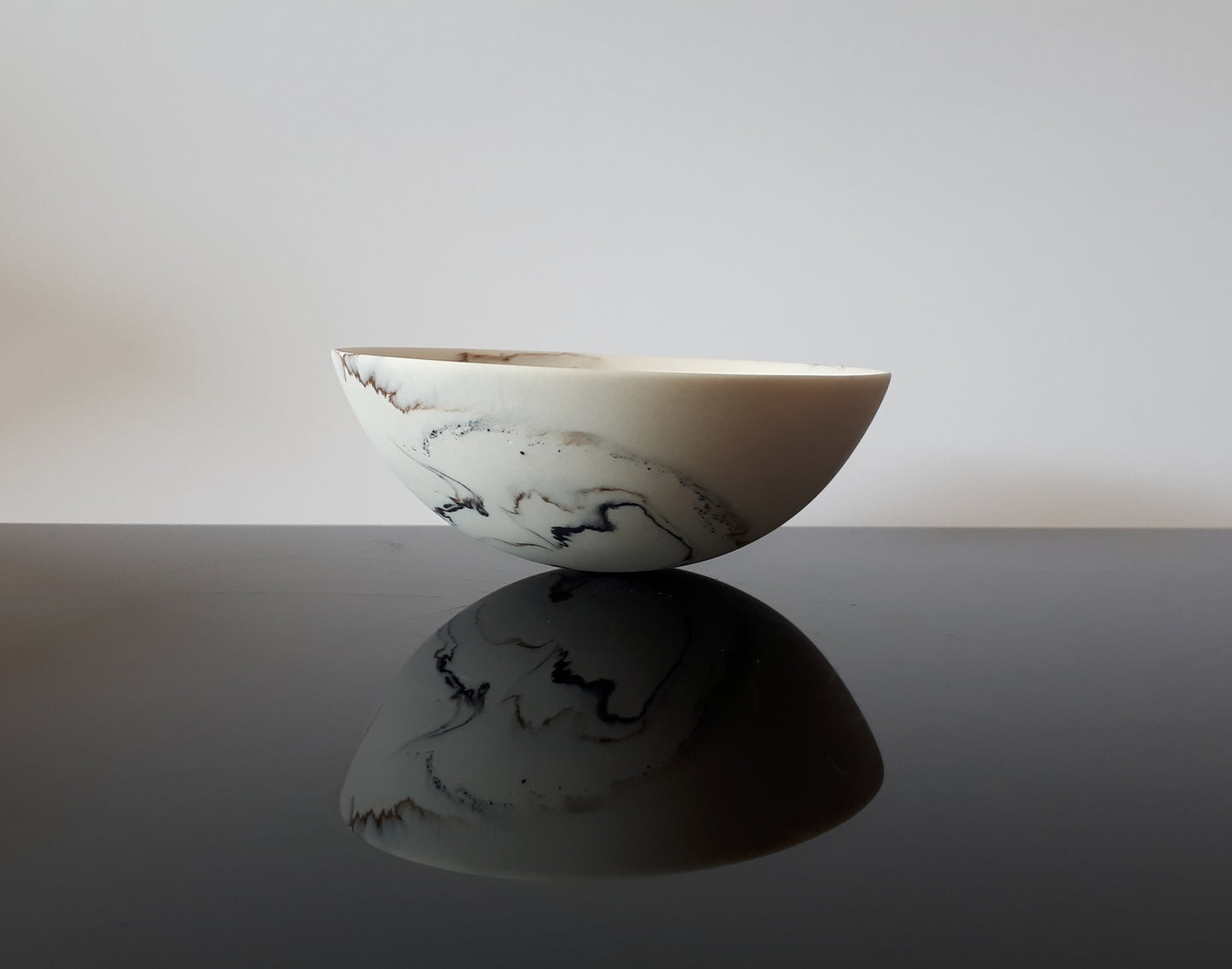 A Porcelain Rocking Bowl