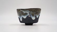 Load image into Gallery viewer, Hand carved black clay bowl with dripping nuka glaze
