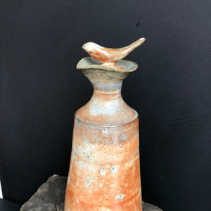 Tall stoneware pouring oil bottle with stopper