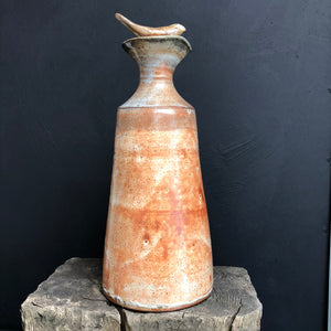 Tall stoneware pouring oil bottle with stopper