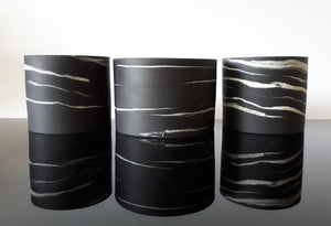 Group of small  black porcelain vessels