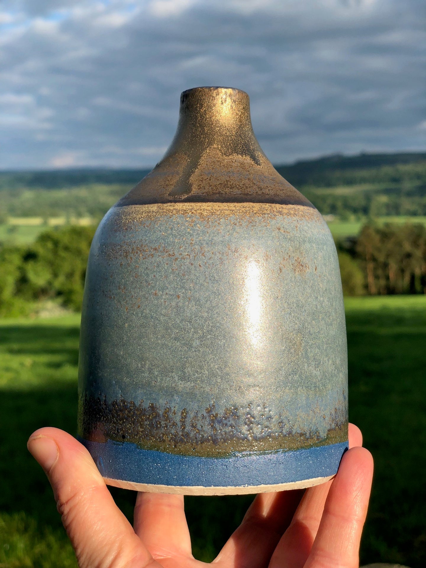 Stoneware bottle with cobalt and bronze glazes