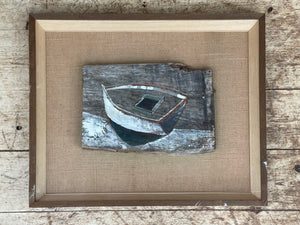 Black and White Boat on Driftwood