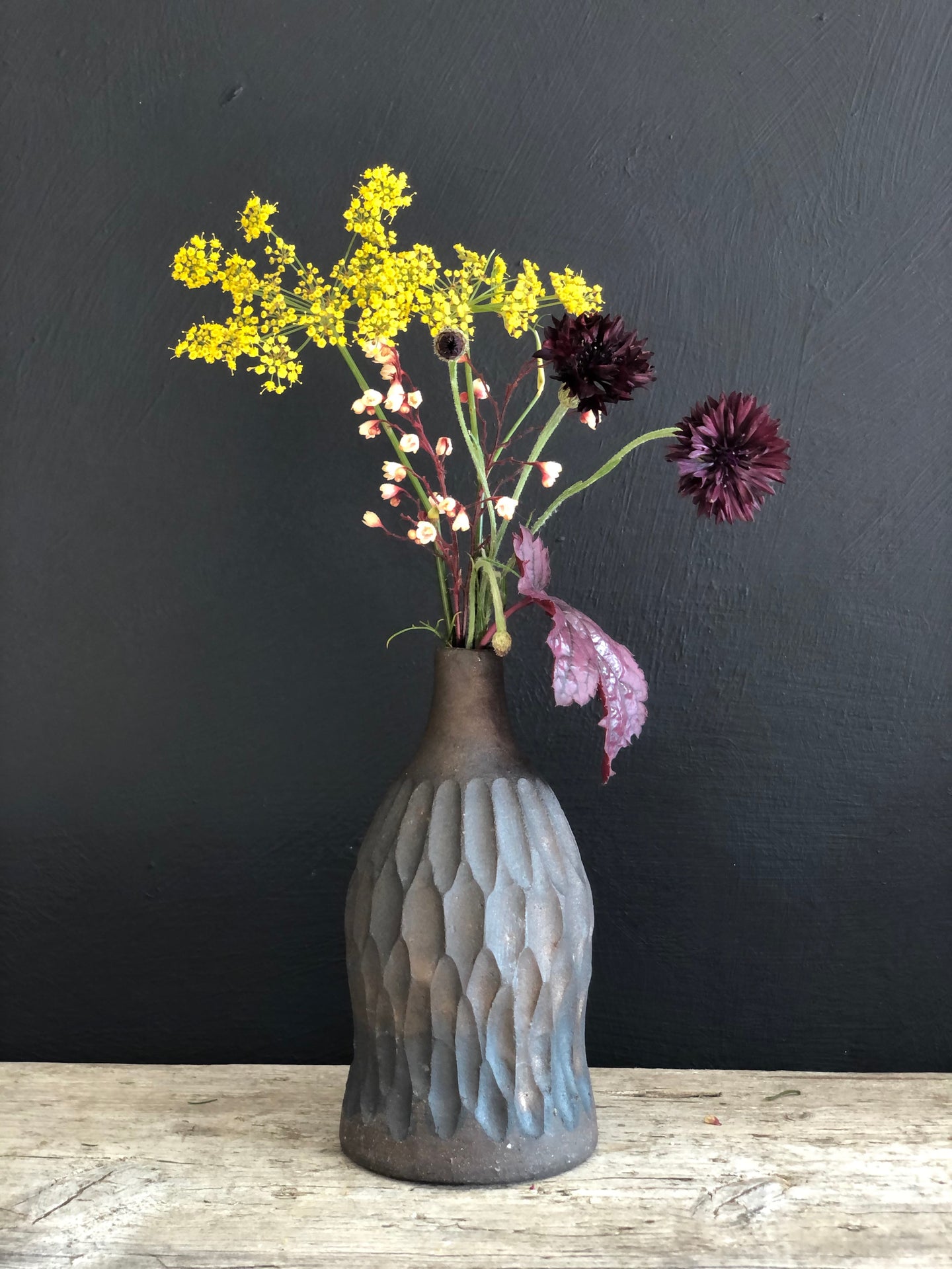 Black clay stoneware bottle bronze glaze