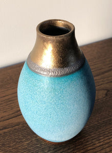 Small blue and bronze vessel