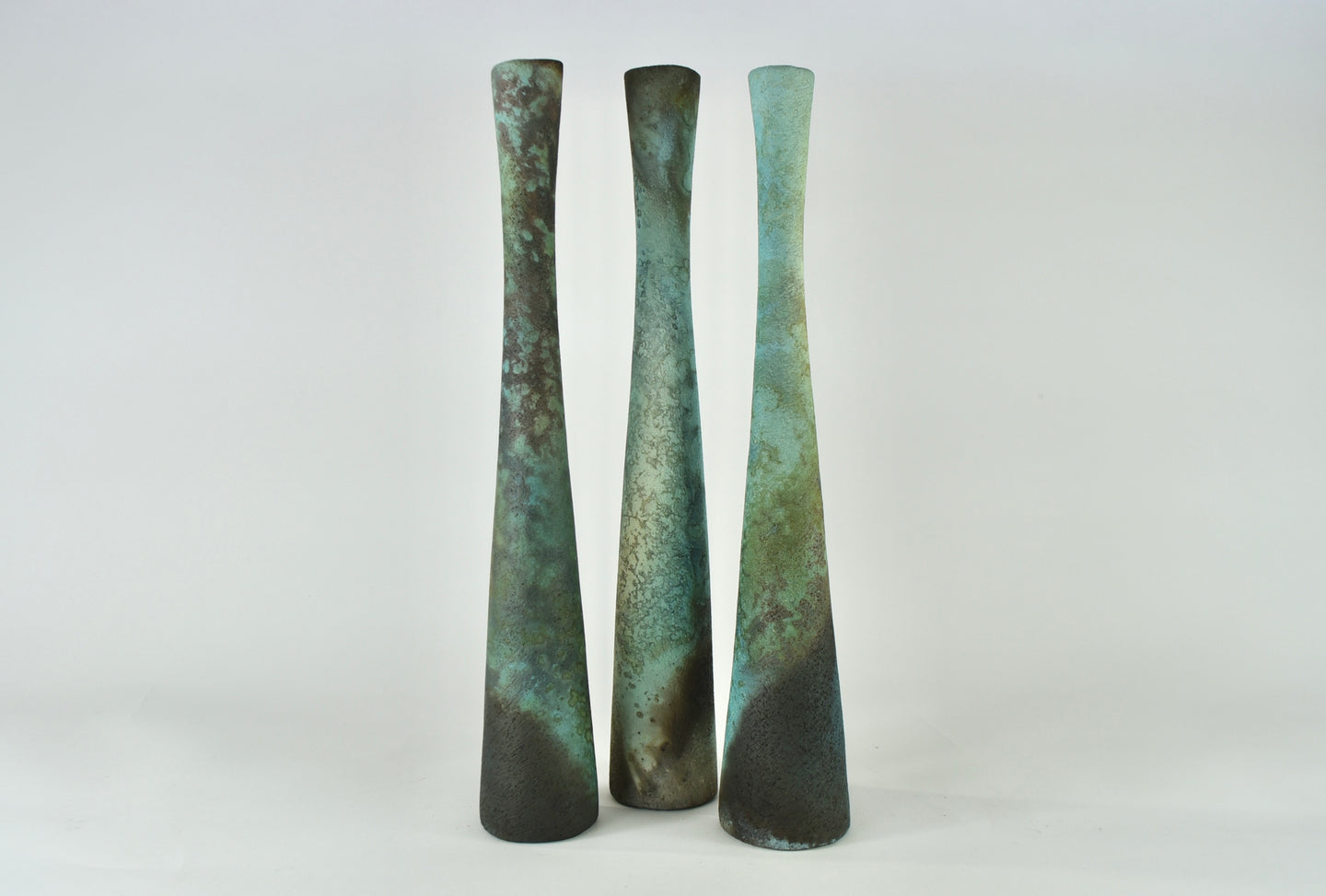 Tall textured smoke fired forms