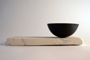 Black Porcelain Rocking Bowl on geological plinth