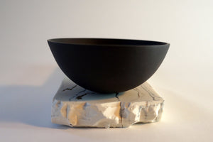 Black Porcelain Rocking Bowl on geological plinth