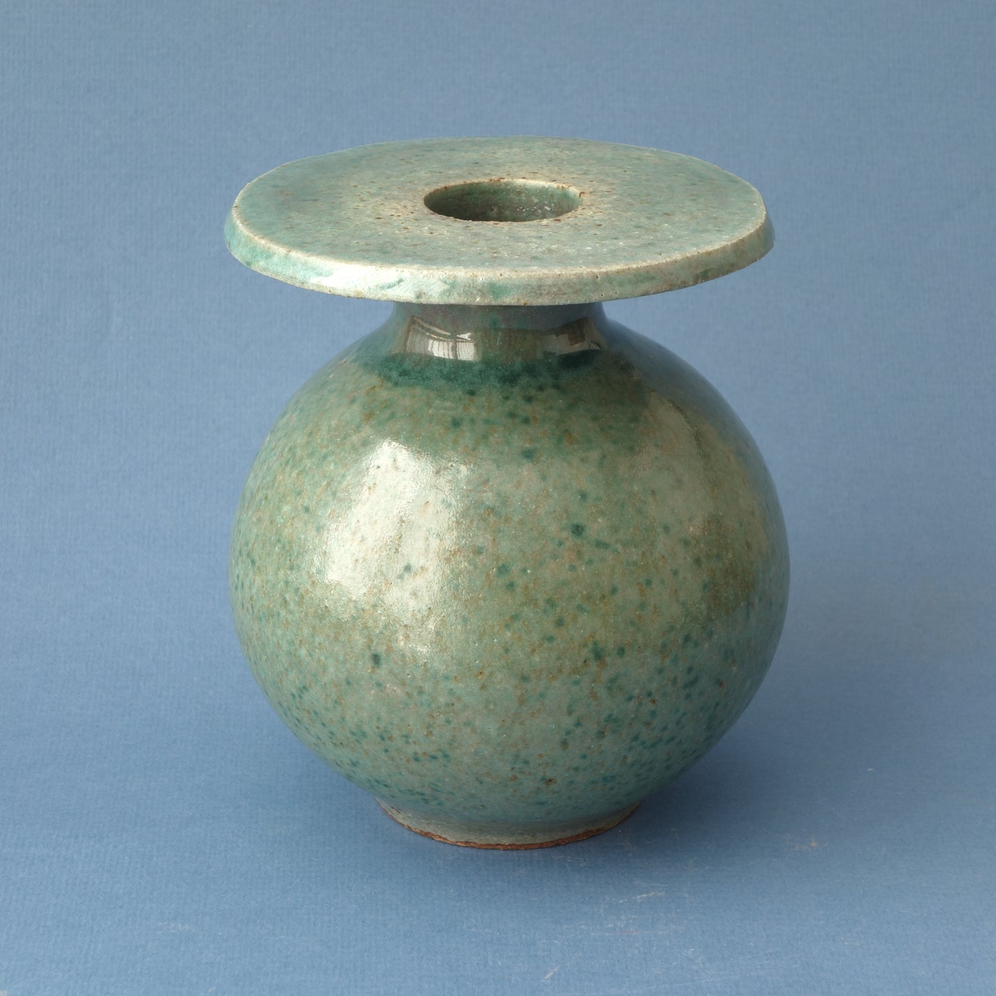 Small round flanged bottle