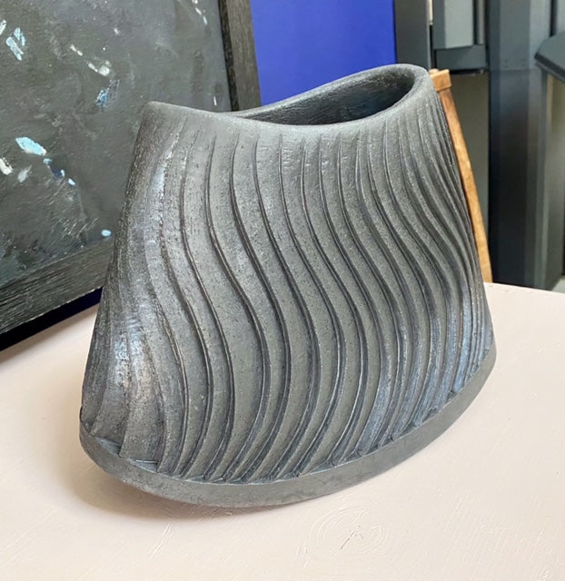 Curved carved vessel