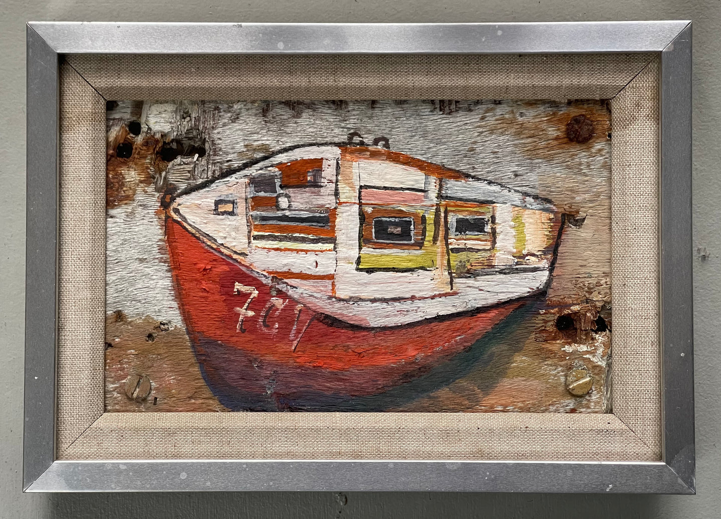 7CV Red and Black Boat on Driftwood