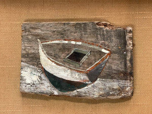 Black and White Boat on Driftwood